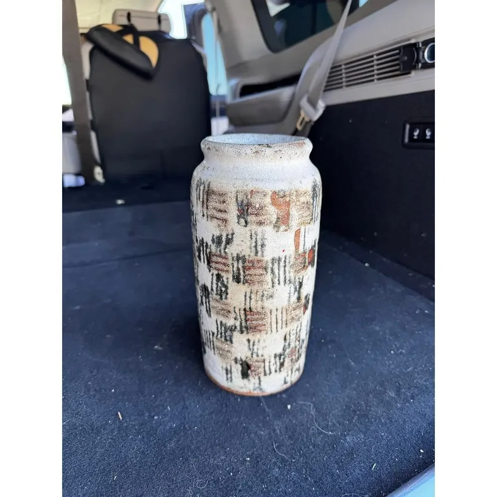 Hand-thrown studio pottery vase textured impasto glaze earthy palette signed